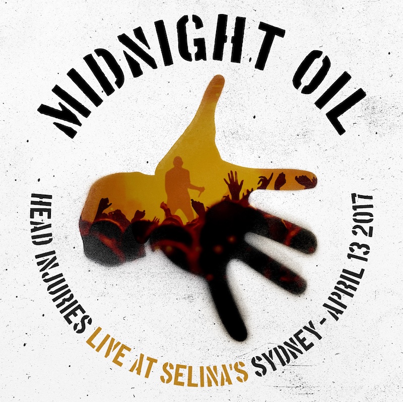 Midnight Oil performing Head Injuries (Live At Selina’s), showing Peter Garrett singing intensely next to a saxophone player.